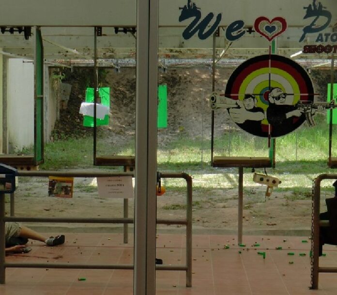 A man lies dead of self-inflicted gunshot wound Wednesday at the Patong Hill Shooting Range in Phuket.