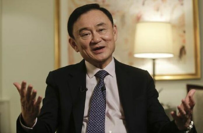 Thailand's former Prime Minister Thaksin Shinawatra responds to questions during a news interview Wednesday, March 9, 2016, in New York. Photo: Frank Franklin II / Associated Press