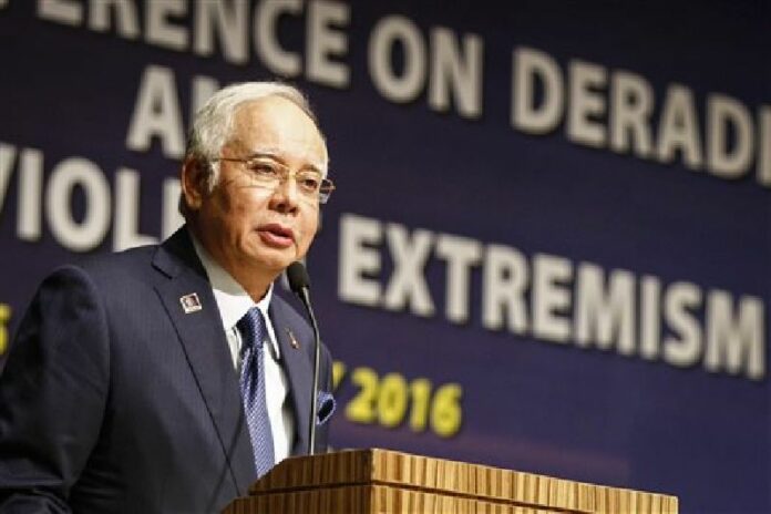 In this Monday, Jan. 25, 2016 file photo, Malaysian Prime Minister Najib Razak speaks at a conference in Kuala Lumpur, Malaysia. Photo: Joshua Paul / Associated Press