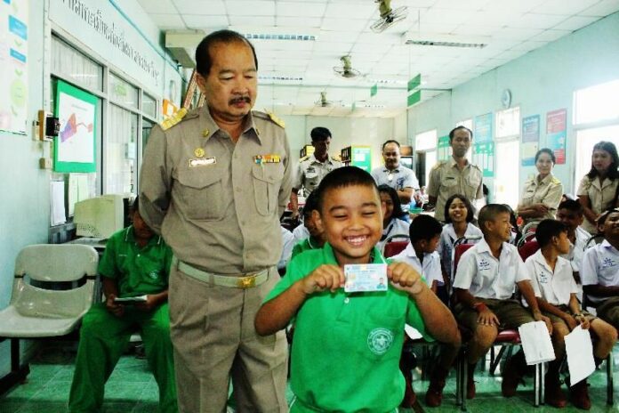 Young boy gets his smart national ID card for the first time in 2011.