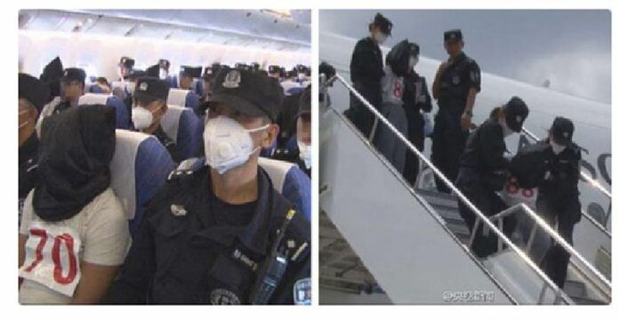 Chinese state media broadcast images on July 11, 2015 of Uighurs deported from Thailand, showing them being transported in black hoods and alleging some have 'terrorist links.' Photo: CCTV