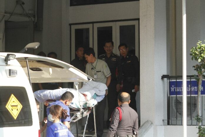 Jenphop Viraporn arrives at Ayutthaya Provincial Court on hospital stretcher on Friday afternoon.