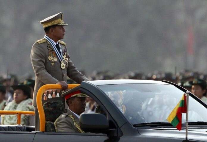Myanmar's commander-in-chief General Min Aung Hlaing inspects officers during a parade Sunday to commemorate the 71st Armed Forces Day in Naypyitaw, Myanmar. Photo: Aung Shine Oo / Associated Press