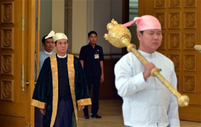 Lower House Speaker Win Myint, second left, walks to commence a session of the lower house parliament on Thursday, March 10, 2016 in Naypyitaw, Myanmar. Photo: Aung Shine Oo / Associated Press