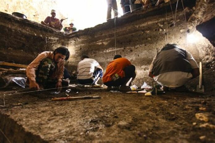In this 2012 photo provided by the Liang Bua Team, archaeological excavations of Holocene deposits at Liang Bua are conducted on the Indonesian island of Flores. Photo: Liang Bua Team / Associated Press
