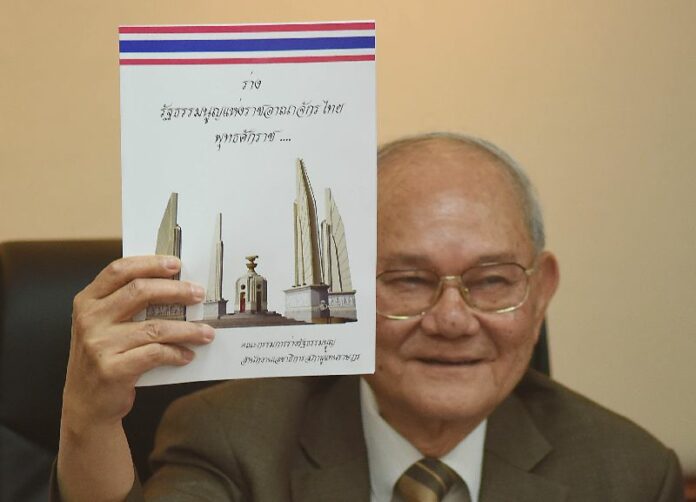 Constitution Drafting Committee Chairman Meechai Ruchuphan presents the final draft of the proposed charter Tuesday in Bangkok.