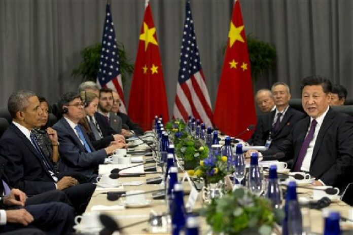 President Barack Obama listens at left as Chinese President Xi Jinping speaks during their meeting at the Nuclear Security Summit in Washington, Thursday, March 31, 2016. Photo: Jacquelyn Martin / Associated Press