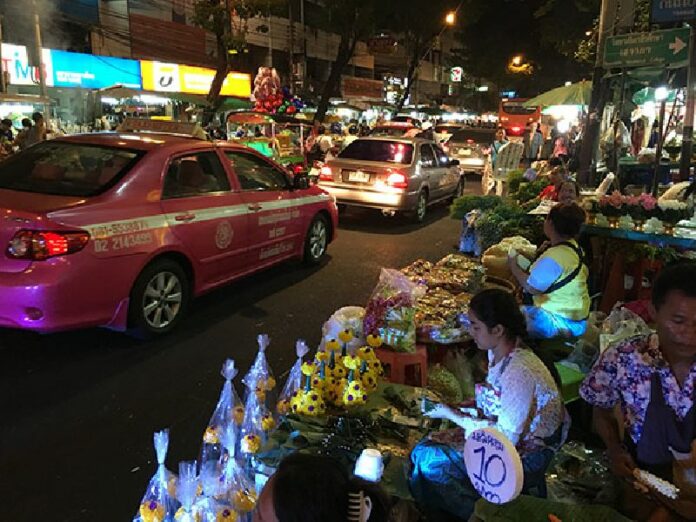 Vendors selling flowers along the roadside on Valentine's Day, 2016 at Bangkok's Pak Khlong Talad.