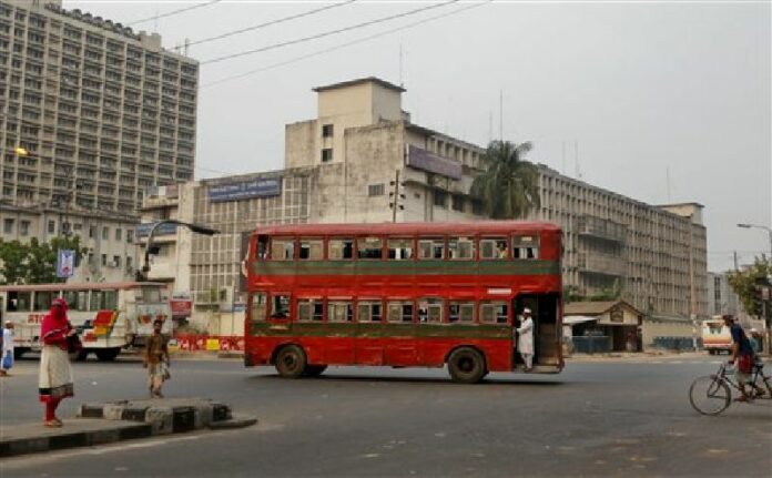 Vehicles move through a road in the morning during a nationwide general strike called by Bangladesh's largest Islamist political party, Jamaat-e-Islami, in Dhaka, Bangladesh, Monday, March 28, 2016. Photo: A.M. Ahad / Associated Press