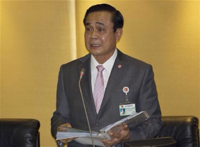 In this Friday, Sept. 12, 2014, file photo, Prime Minister Prayuth Chan-ocha delivers his government's policy statement at parliament in Bangkok. Photo: Sakchai Lalit
