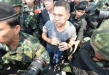 Watana Defiant as He Turns Himself in at Army Base