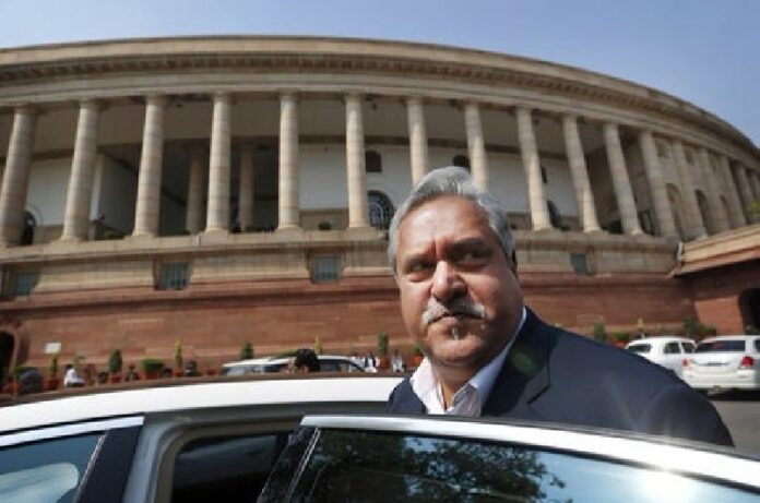 In this Feb. 27, 2013 file photo, Indian business tycoon and owner of Kingfisher Airlines Vijay Mallya gets into his car outside the Parliament in New Delhi, India. Photo: Saurabh Das / Associated Press