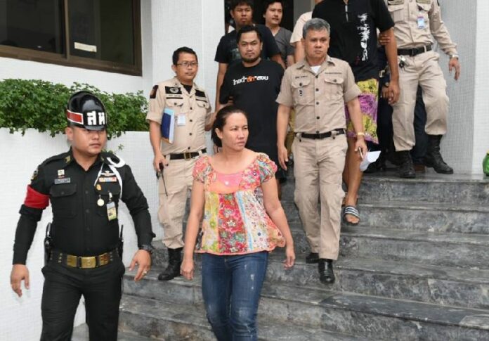 Nuttigar Woratunyawit is escorted to prison April 29, 2017, after bail was denied by a military court in Bangkok.