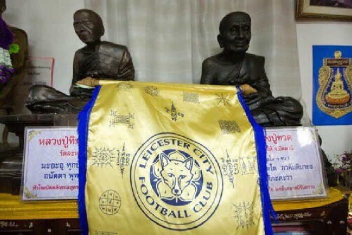 A Leicester City banner hangs in a room at the Wat Traimitr Withayaram temple in Bangkok, Tuesday, May 3, 2016. Photo: Mark Baker / Associated Press.