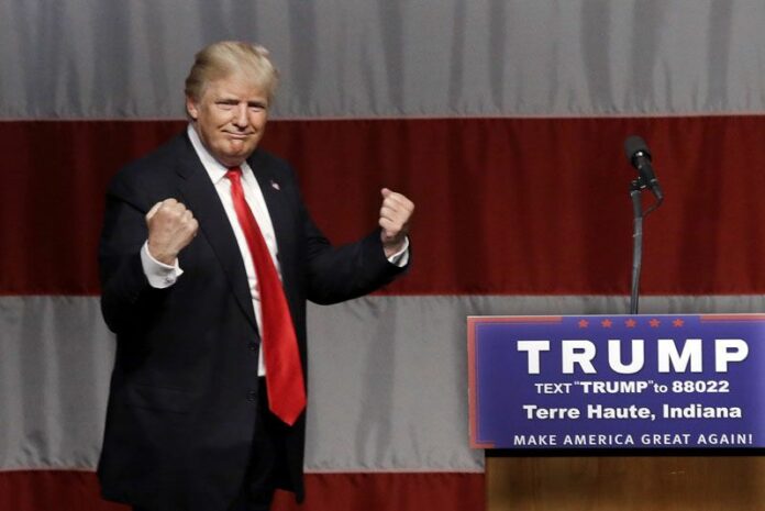 Republican presidential candidate Donald Trump reacts to a song Sunday during a campaign rally in Terre Haute, Ind. Photo: Seth Perlman / Associated Press<br />