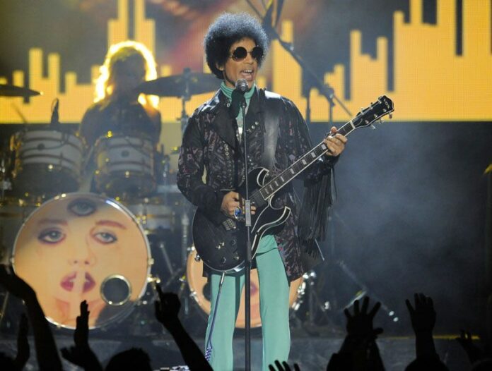 Prince performs at the 2013 Billboard Music Awards in Las Vegas, Nevada. Photo: Chris Pizzello / Invision / Associated Press