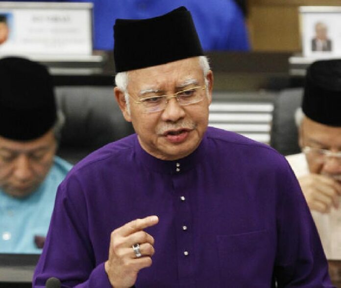 In this Oct. 23, 2015 file photo, then Malaysian Prime Minister and Finance Minister Najib Razak speaks as he unveils the Malaysia's 2016 budget at Parliament House in Kuala Lumpur, Malaysia. Photo: Joshua Paul / Associated Press