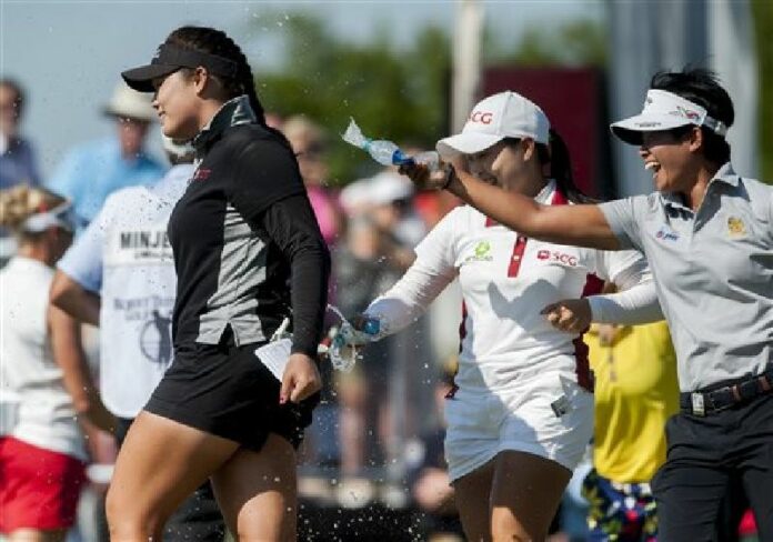 Ariya Jutanugarn, left, is splashed with water on the 18th green after winning the Yokohama Tire LPGA Classic golf tournament in Prattville, Ala., Sunday, May 8, 2016. Photo: Mickey Welsh / The Montgomery Advertiser / Associated Press