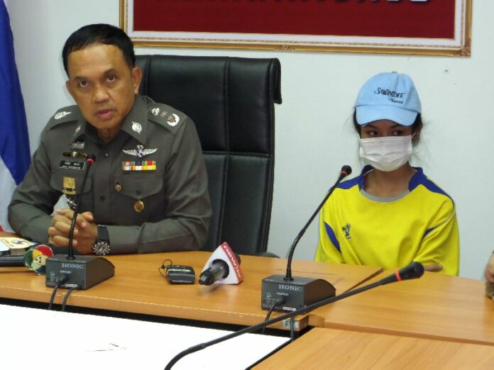 Bangkok interim police chief Sanit Mahatavorn sits next to Natnicha Ritlamlert at Saturday news conference.