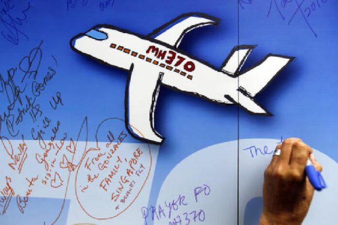 In this March 6, 2016, file photo, well wishes are written on a wall of hope during a remembrance event for the ill fated Malaysia Airlines Flight 370 in Kuala Lumpur, Malaysia. Photo: Joshua Paul / Associated Press