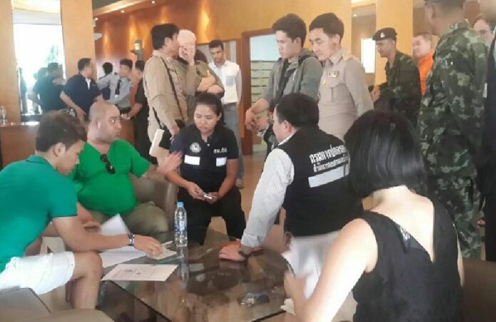 Authorities raid Liberty Park II Condominium Thursday in Soi Sukhumvit 11, Bangkok.