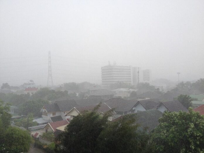 Low visibility due to rain Monday afternoon in Bangkok's Chatuchak district.