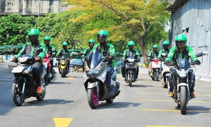 GrabBike taxi operators in a promotional image posted Feb. 3. Photo: Grab / Facebook