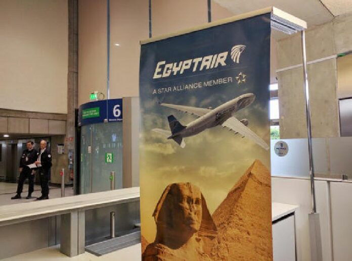 Airport security staff stand near the EgyptAir counter at Charles de Gaulle Airport outside of Paris, France, Thursday, May 19, 2016. EgyptAir said a flight from Paris to Cairo disappeared from radar early Thursday morning. Photo: Raphael Satter / Associated Press
