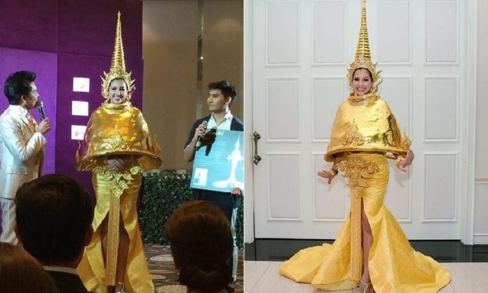Kanthicha ‘Yui’ Chimsiri presents her ‘Golden Pagoda’ costume for Mrs. Universe 2016 on Tuesday in Bangkok.