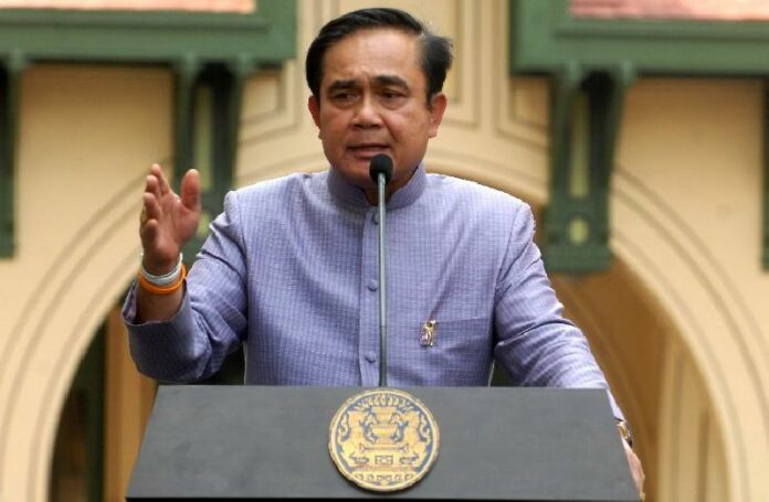 Gen. Prayuth Chan-ocha speaks to reporters on Mar. 3, 2015, at the Government House in Bangkok. Under his order, more than 100 people must seek his permission before traveling abroad.