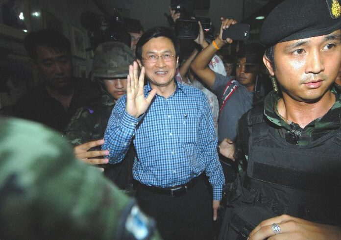 Soldiers arrest Chaturon Chaisang on May 28, 2014, when he showed up at the Foreign Correspondents' Club of Thailand in Bangkok. He previously refused to report to the junta’s summon for detention.