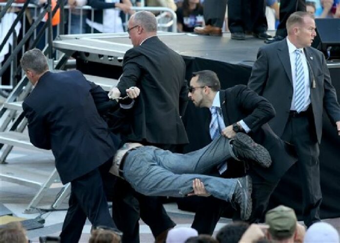 Secret Service agents remove a man from the crowd during a campaign rally for Democratic presidential candidate, Sen. Bernie Sanders, I-Vt., at Frank Ogawa Plaza in Oakland, Calif., on Monday, May 30, 2016. Photo: Anda Chu / Oakland Tribune / Associated Press