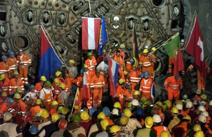 In this Sept. 6, 2006 file photo miners celebrate a breakthrough in the NEAT Gotthard base tunnel in Faido, Switzerland. Photo: Karl Mathis / Keystone / Associated Press